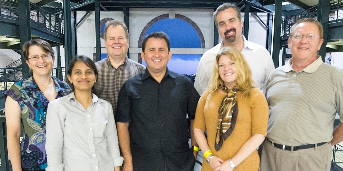 A group of people standing in front of a building.