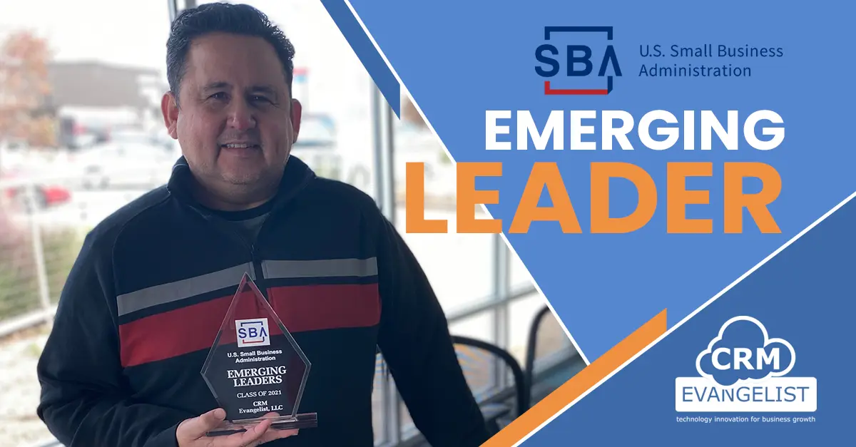 A man holding an award in front of the words emerging leaders.